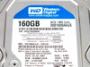 Western Digital WD1600AAJS drive label close-up showing model WD1600AAJS-62B4A0, 8MB cache, SATA, S/N, manufacture date July 2009