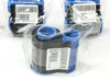 Three Zebra PL5 black ribbons in plastic wrap showing label detail and ribbon spool with blue end caps