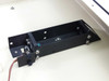 API UniScept Plus Autoreader – internal optical reader/lamp assembly detail showing light source holder, wiring, and mounting bracket