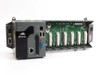 ICP DAS XP-8741 XP-8000 embedded industrial PC — front and left side showing CPU module with LAN, USB, VGA ports and open 7-slot backplane with I/O module expansion connectors
