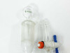 Two PTFE stopcock assemblies with orange tops and blue handles removed from glass burets — detail view
