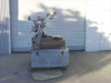 Helicopter Camera Systems 807-A mount system with 806A arm on wooden shipping crate, side view showing full rig height