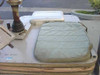 Platform base showing anti-vibration seat cushion, white storage case/windshield cover, and NO STEP placard