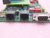 QLogic ZIRCON_DB.002 close-up showing dual RJ-45 ports and DB9 serial connector on card bracket edge