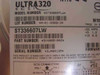 Seagate ST336607LW Ultra320 SCSI HDD label showing model number, part number 9V4005-002, serial number, and SCSI connector pinout