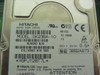Hitachi DK23BA-10 hard disk drive label showing 10.06GB capacity and 5V 0.5A power spec