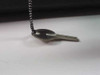 Close-up of the carry case lock key on a metal chain