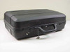 Unbranded hard shell carry case closed view showing top handle and lock with key attached on chain