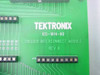 Tektronix IGS-1614-60 internal PCB label showing TEKTRONIX IGS-1614-60 TRIGGER INTERCONNECT MODULE REV A silkscreen on green circuit board with JP30 jumper block