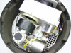 Interior view of AU323-5 antenna enclosure showing motor-driven RF antenna assembly, blower, RF module housing, and internal wiring harness