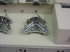 Interior top-down view of Stations 3 and 4 showing chrome electrode fixture mechanisms mounted in the station bays