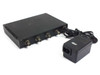Black Box Multiport Repeater 1050 LE1050A-BNC rear view with included external IEC-inlet power adapter beside unit