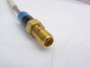Close-up of gold-plated SMA Female connector end with blue and black heat shrink strain relief on Times Microwave RF cable