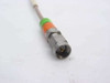 Close-up of SMA Male connector end with green and orange color band markings on Times Microwave coaxial cable