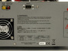 Kikusui TOS9201 AC/DC Hipot Tester front panel with kV analog meter, LCD display, and high-voltage output terminals — top view with test leads draped over unit