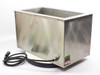 Delta Sonics DT1021 ultrasonic cleaning tank rear and side view showing stainless steel exterior with discoloration and generator cable coiled beneath