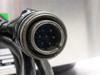 Closeup of 7-pin circular military-style connector on Delta Sonics DT1021 generator cable showing tarnishing and pin detail