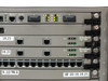 Close-up of middle card slots showing ATM Speed/155 NC management ports (10Base-T, RS-232/MCP), two EtherSpeed 10/100 boards with RJ45 ports and green Link LEDs lit, and 24-port Token Ring trunk row at bottom