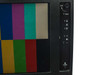 Videotek RMM-505B front panel right-side controls close-up showing LOCK key slot, MENU button, adjustment buttons, and POWER button with color bar test pattern visible on screen