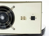 BTS PS1200 rear panel left section close-up showing IEC inlet J1, terminal block J2, duplex AC outlet, and rating plate