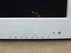 Dell W3000 front panel controls — CH and VOL buttons, input selector, power button, and LED indicator; screen scratch visible in upper portion of panel