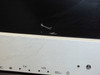 Close-up of Dell W3000 screen scratch — curved scratch mark visible in the lower portion of the screen near the bezel