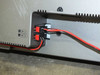Dell W3000 rear speaker wire connection detail — dual spring-clip speaker terminals with red and black wiring attached to main panel