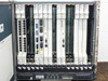Interior front view of Cisco ONS 15454 shelf showing all installed cards — E100T, OC3, XCVT, TCC+, DS3, DS1 — with slot labels