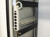 Interior of Varian VZC6967R4 cabinet – white 6-outlet PDU power strip mounted vertically to interior side rail