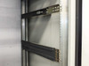 Interior detail of Varian VZC6967R4 cabinet – mounted slide rail hardware with locking mechanisms visible
