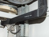Xicom Technology rack cabinet interior — label on black mounting bar reading '734-0221-003 REV B' (internal part number)