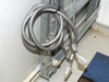 Xicom Technology rack cabinet — lower interior view showing bundled multi-pin cable assemblies with HD connectors resting on floor panel