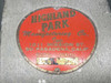 Highland Park Manufacturing Co. nameplate – red circular badge reading '1011 Mission St., So. Pasadena, Calif.' with MODEL and SERIAL fields partially worn/obscured