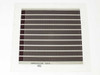 Konarka Power Plastic Model 110 flexible solar cell — front face showing dark brown OPV stripe pattern with metallic grid collector lines on clear flexible substrate