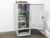 Balzers RFS 302 RF Power Supply – interior view with cabinet door open, showing internal rack-mounted components and Fritz Hüttinger RF generator module