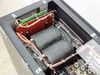 Eratron PPS 8210 RS MF – interior detail of dual transformer/inductor assembly with red PCB board and copper wiring
