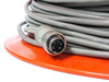 Close-up of 5-pin male circular connector end of gray data extension cable on orange spool