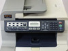 Brother MFC-9440CN — close-up of front control panel with LCD display, Print/Fax/Copy/Scan function buttons, and numeric dial pad