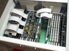 Epro 142AX interior view with lid open – showing full set of installed test boards with ribbon cable connections, fan, and power supply