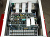Epro 142AX interior overhead view – multiple green PCB test boards with yellow component arrays installed in card cage with ribbon cables