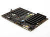IBM 6323560 XM 64-256KB System Board rear three-quarter view showing AT power connectors, keyboard connector header, ISA slot edges, and installed chip complement