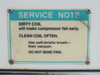 Service note label on chiller — instructs to clean condenser coil often with soft-bristle brush to prevent compressor failure