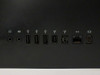 Apple iMac A1225 rear port panel showing headphone jack, line-in, three USB 2.0 ports, FireWire 400, FireWire 800, Gigabit Ethernet, and Mini-DVI