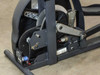 Precor EFX 5.17 drive mechanism — flywheel cover removed, showing flywheel, crank arm, drive belt, and servo motor