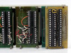 Det Tronics Model 880 monitor board close-up – part number 226138-01 AW Rev B, terminal blocks TB1 through TB5, red and black wiring, and rightmost backplane/interface board visible