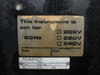 Tegimenta AG internal voltage selector label showing 208V selected, 60Hz, Swiss manufacture plate with Type RC70 and serial number