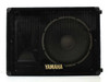 Yamaha S12Me SE Series floor monitor – single unit straight-on front view showing 12-inch driver behind metal grille and Yamaha logo badge