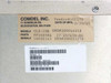 Comdel CLX-10K label close-up showing model CLX-10K, part number FP1605RA, secondary part 27-257659-00, serial 16050143, date of manufacture 2/10/05, and Novellus part number label with Revision A