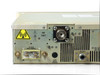 Comdel CLX-10KW – close-up of rear lower-left area showing RF OUT BNC, DC BUSS 48VDC NOMINAL input terminals, FLOW SWITCH CONTROL connector, and WATER IN port with water specification label