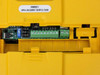 Rhymebus RM6E1-2005B3 – internal control terminal board view showing green screw terminals, source/FMI/FMV DIP switch, and wiring connector block